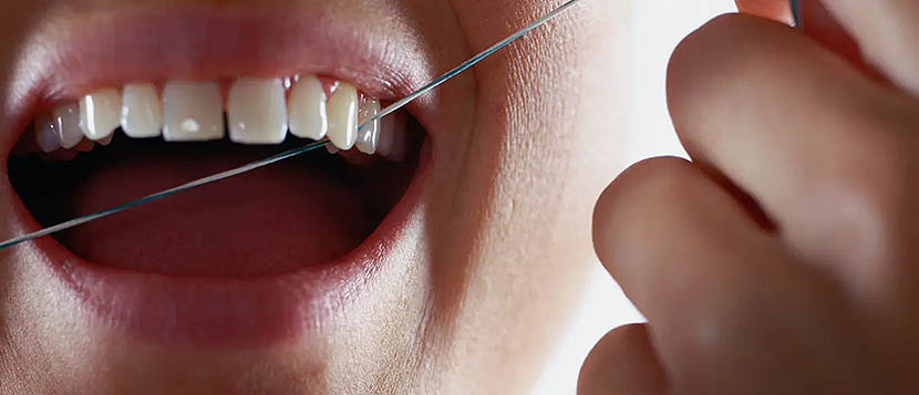 Woman Dental Flossing Teeth